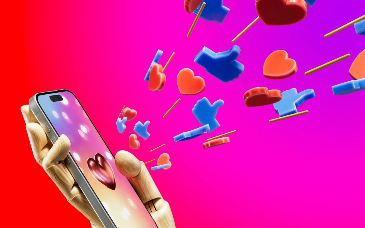mano con telefono like e cuori concetto michelle comi le iene